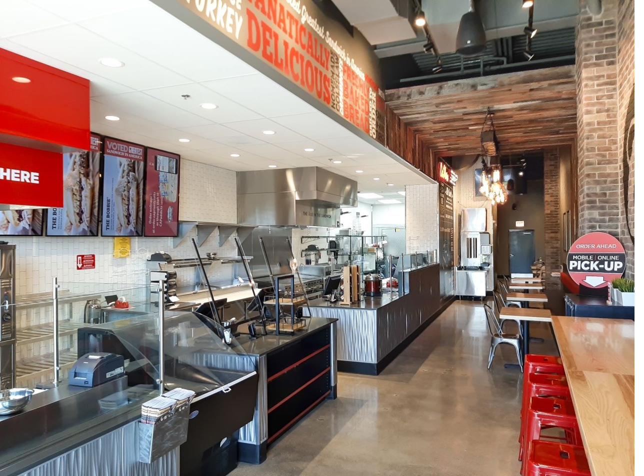 Polished concrete floor in a sandwich shop dining area