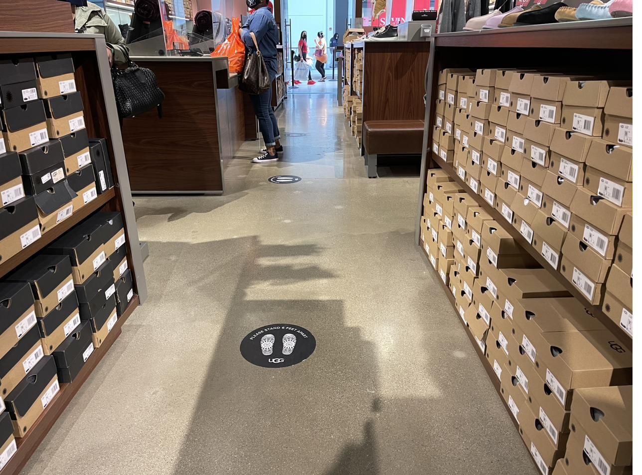 Terrazzo style polished concrete floor in a UGG retail store